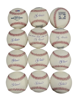 Lot of (12) Yogi Berra Signed Baseballs